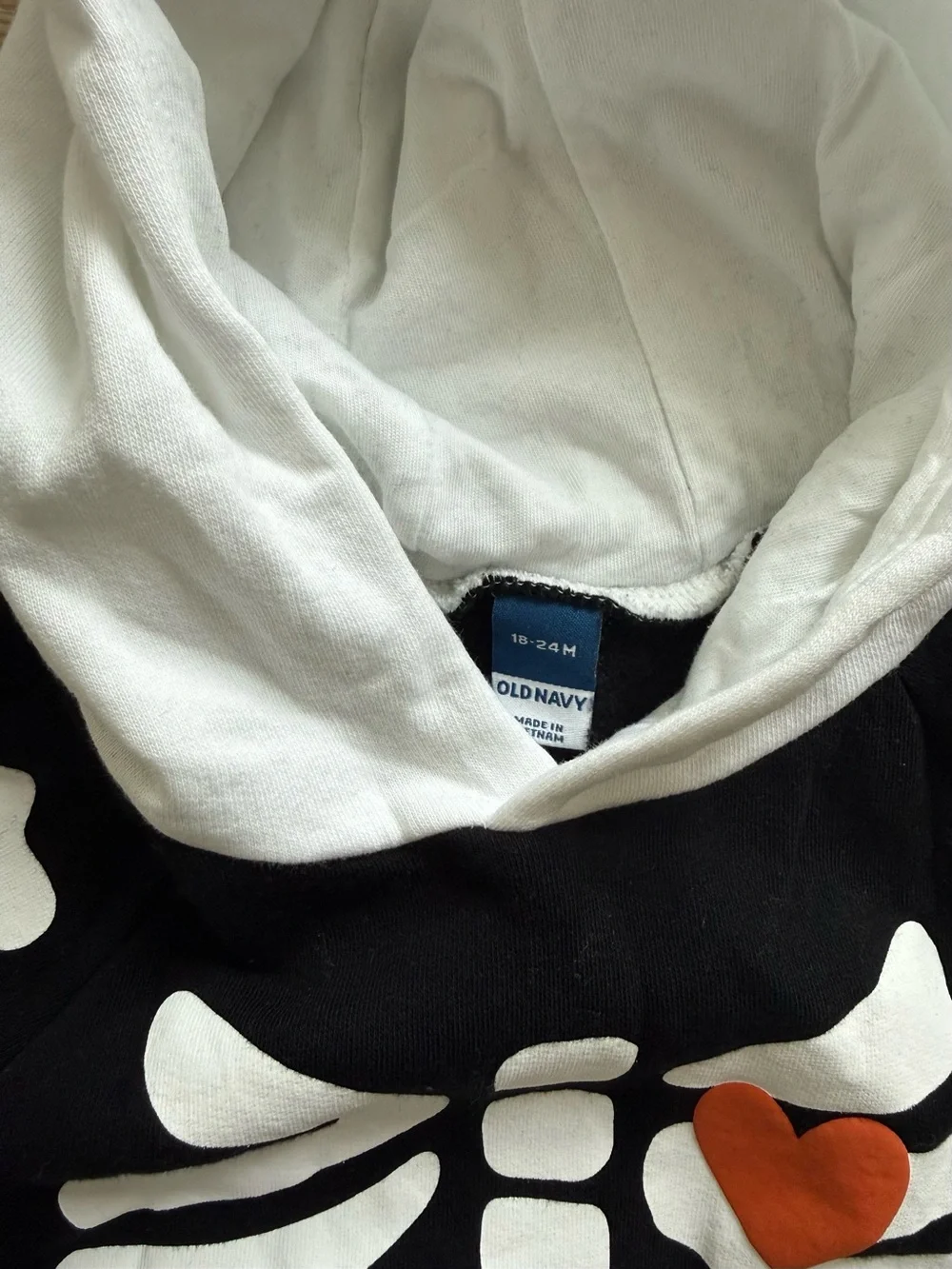 Old Navy Black and White Skeleton Hoodie Romper with Orange Heart